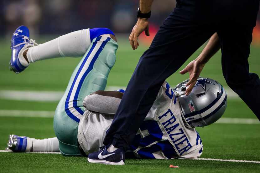 Dallas Cowboys defensive back Kavon Frazier (35) is checked out after an injury during the...