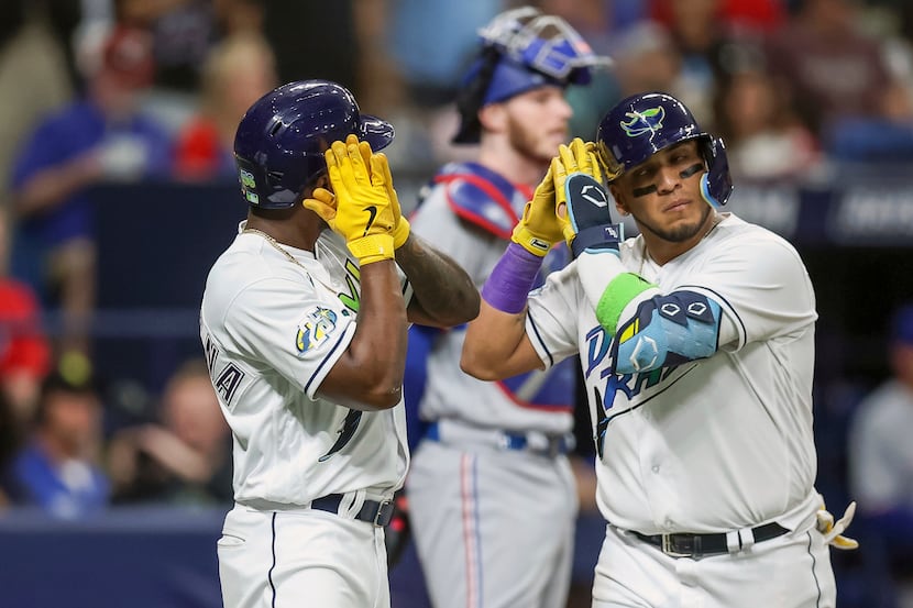 Tampa Bay Rays' Isaac Paredes, right, celebrates after his three-run home run with Randy...