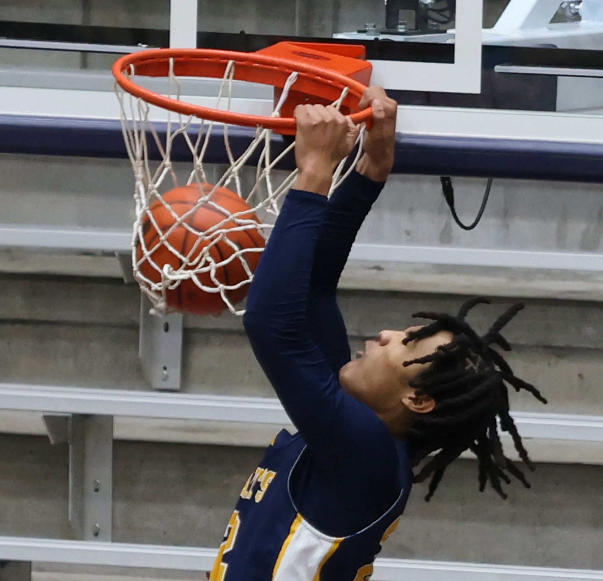 St. Mark's guard Asher Collins (22) scores on an uncontested dunk during second quarter...