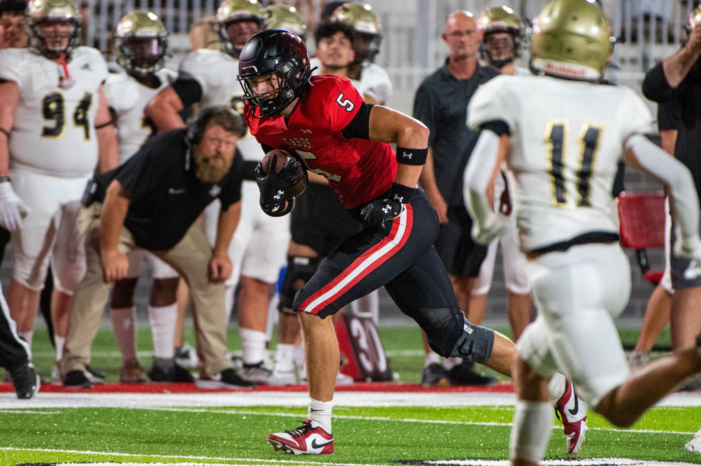 Melissa's Jackson Ford (5) runs upfield after a catch in the first half during a high school...