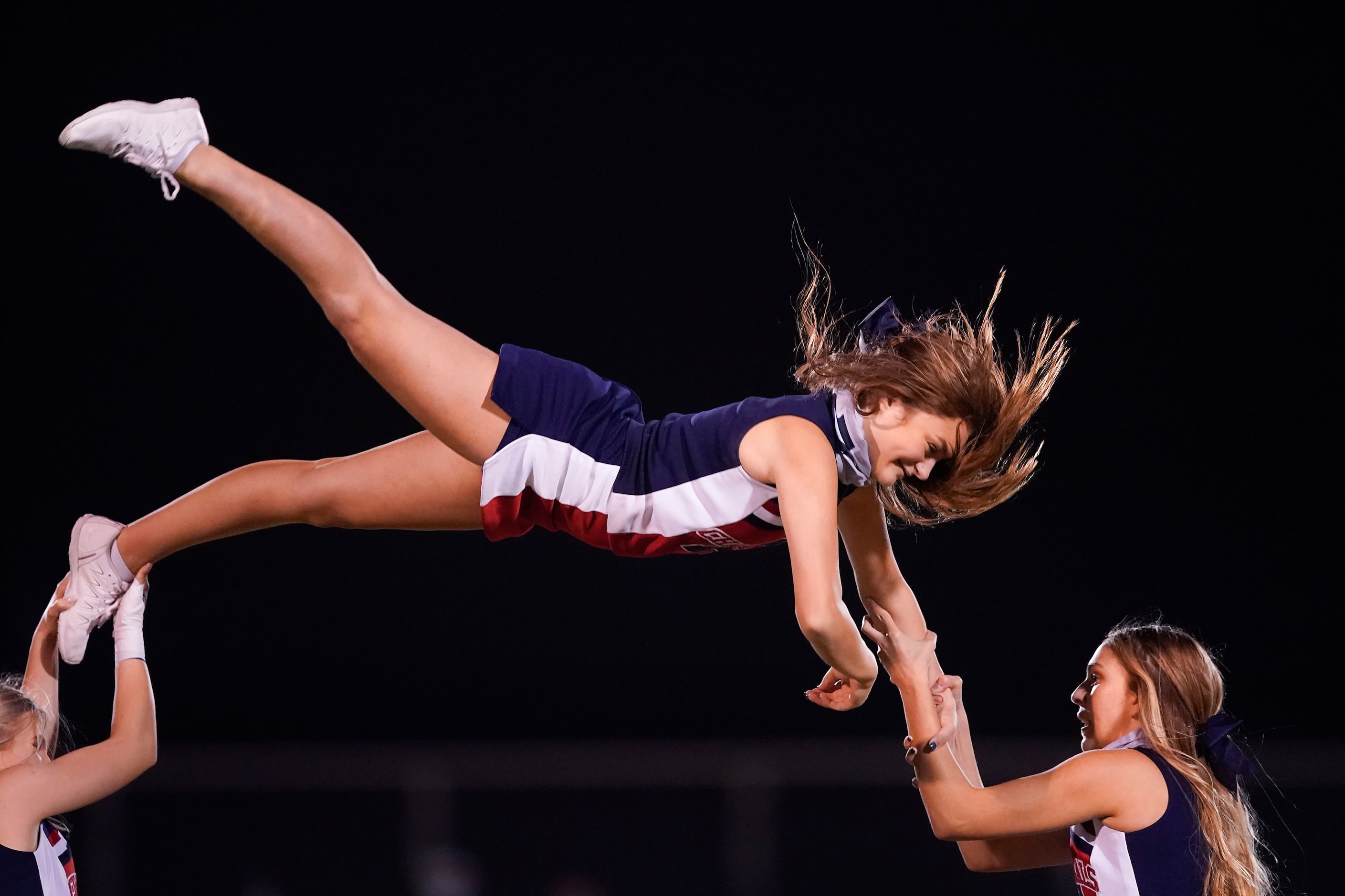 Aubrey cheerleaders perform at halftime of a high school football game against Terrell on...