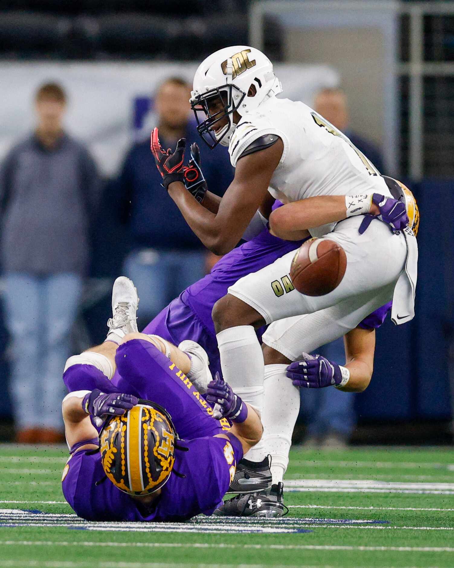 Liberty Hill linebacker Aaron Brewer (3) and Liberty Hill defensive back Carter Hudson (24)...