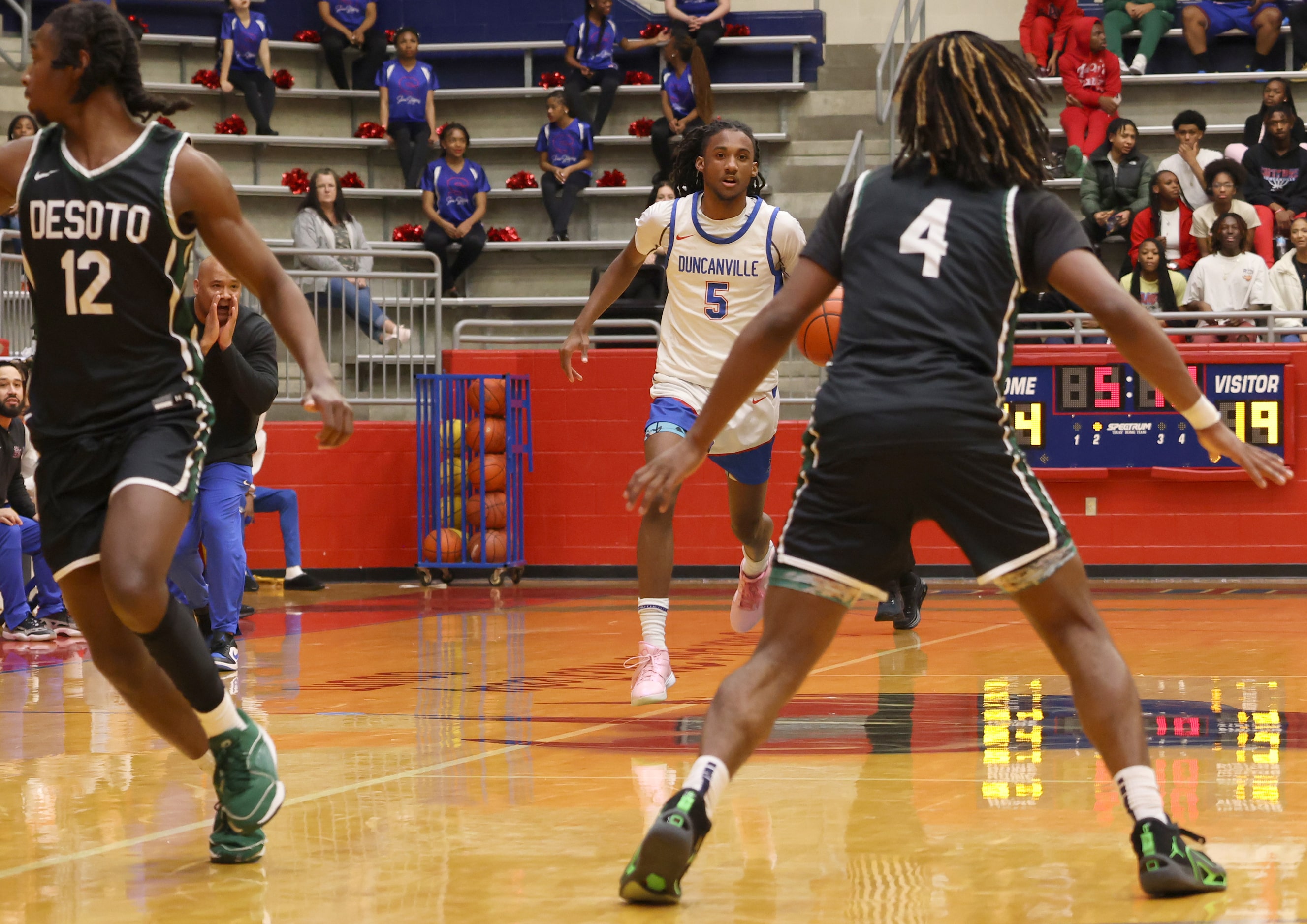 Duncanville guard Bugg Edwards (5) dribbles to begin an offensive drive as head coach David...