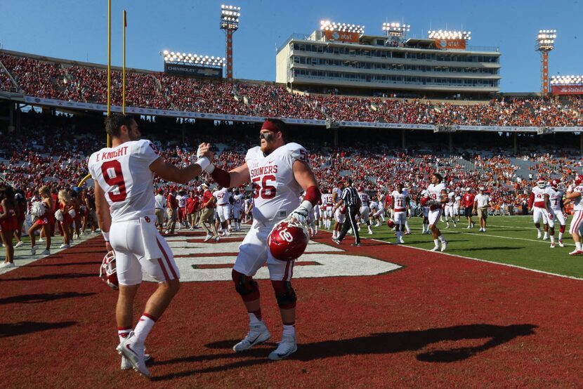 DALLAS, TX - OCTOBER 10:  (L-R) Trevor Knight #9 of the Oklahoma Sooners and Ty Darlington...