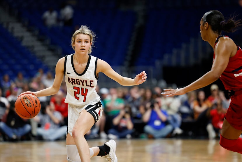 Argyle guard Ashlin Crabtree (24) pushes the ball up the floor past Hardin-Jefferson guard...