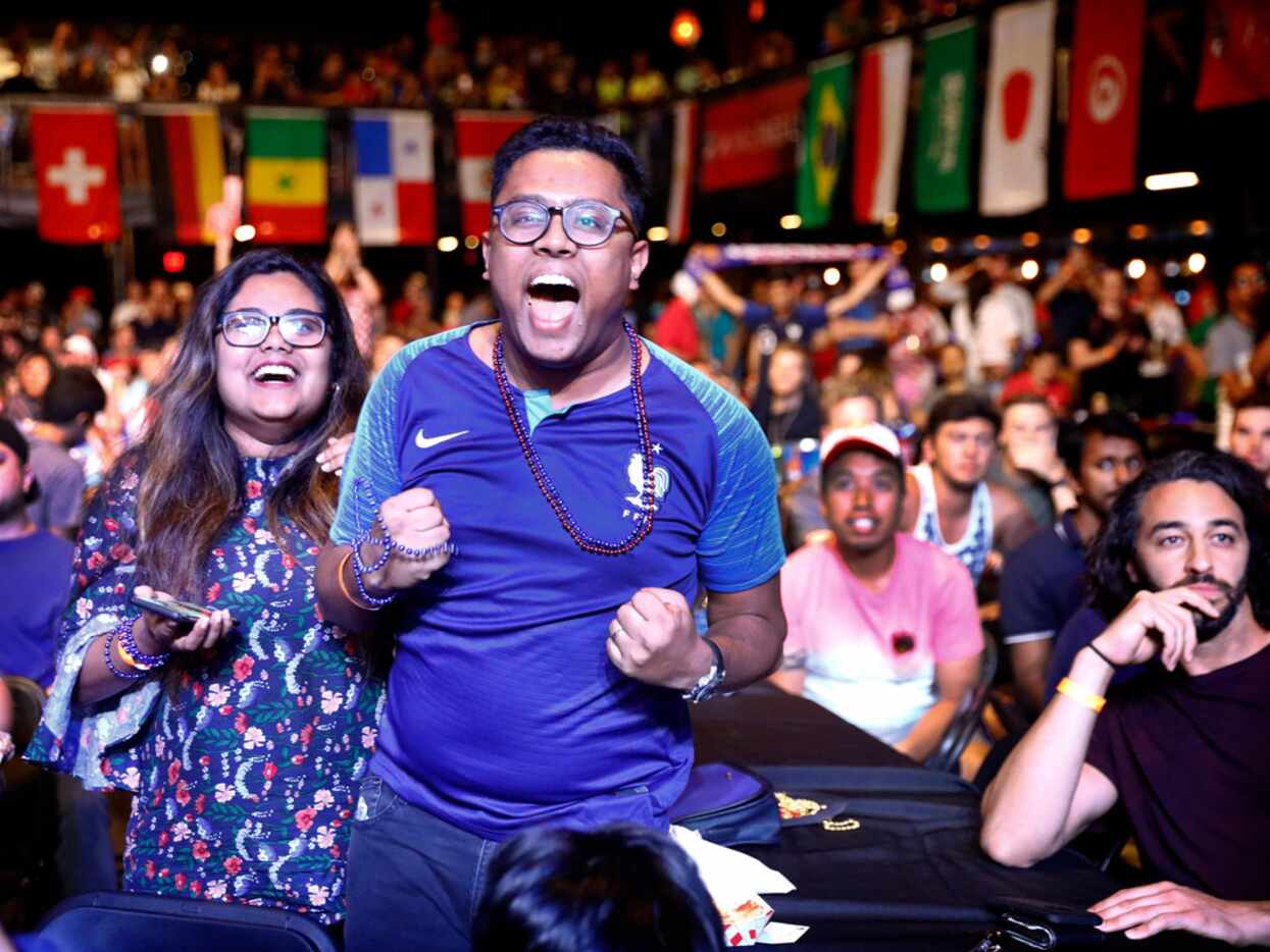 French soccer fans Sadman Ahmed and his wife Nafisa Ahmed of Irving, Texas celebrate their...