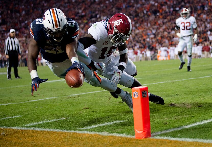 Auburn running back Kerryon Johnson (21) dives for the end zone and gets a first down as...