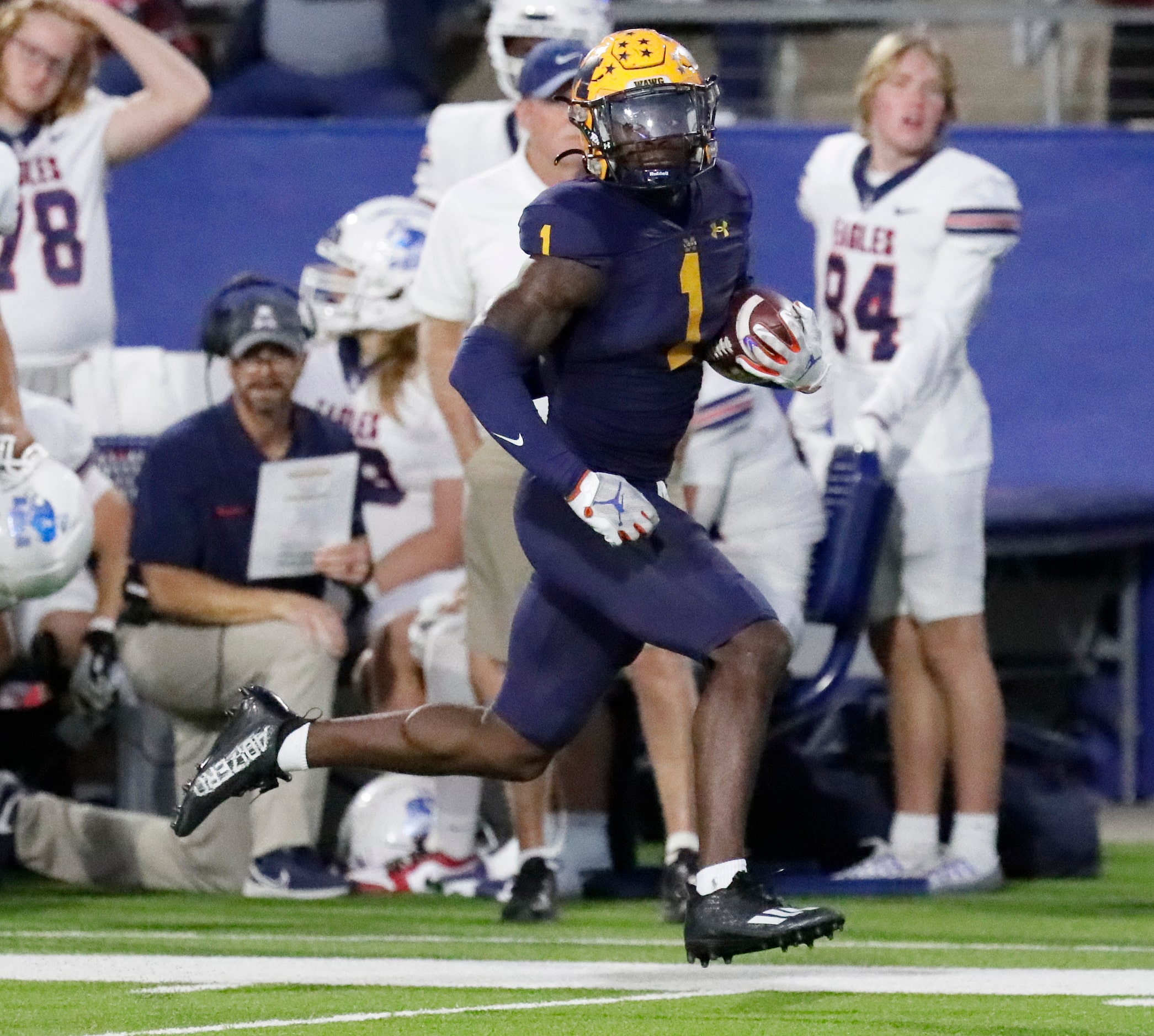 McKinney High School wide receiver Xavier Filsaime (1) heads to the end zone for the first...