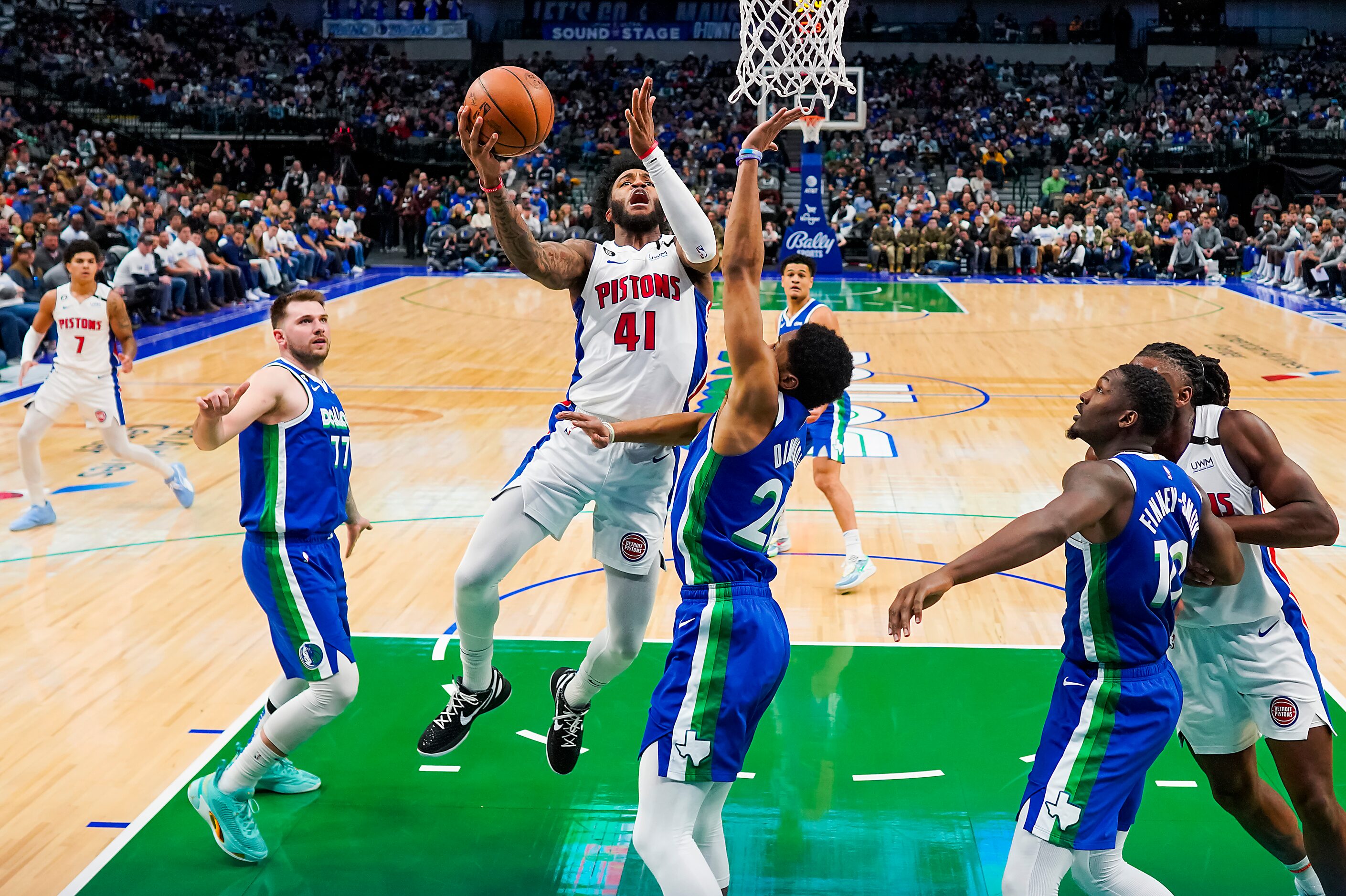 Detroit Pistons forward Saddiq Bey (41) drives to the basket against Dallas Mavericks guard...