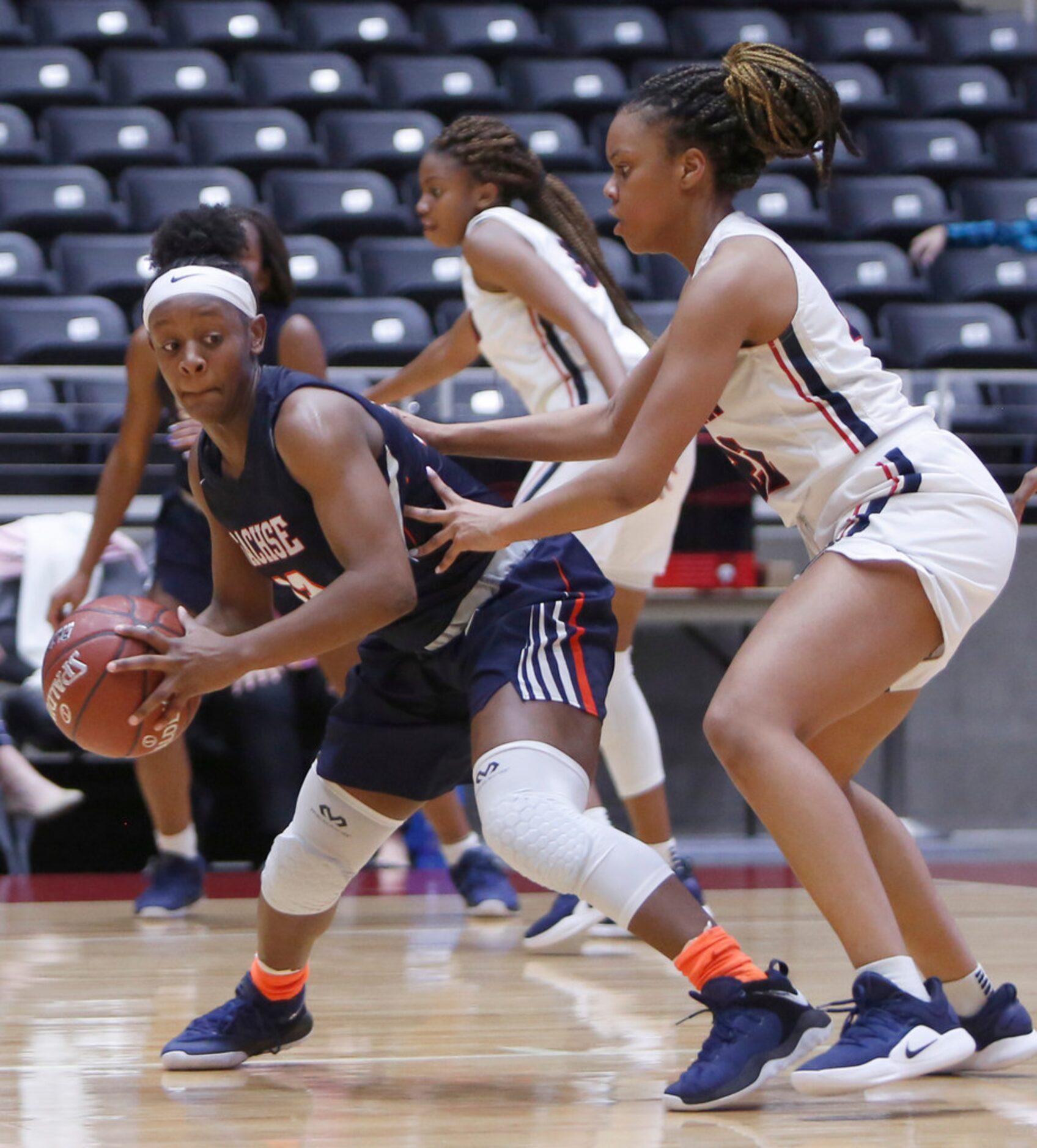 Sachse guard Jayla Brooks (13) looks to drive around the defense of Allen forward Tyler...