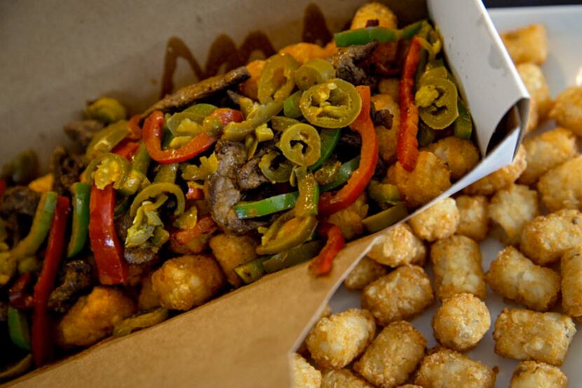 The Holland Hot Tot'Chos, a new Texas Rangers food concession, cost $17.50. Find them in...