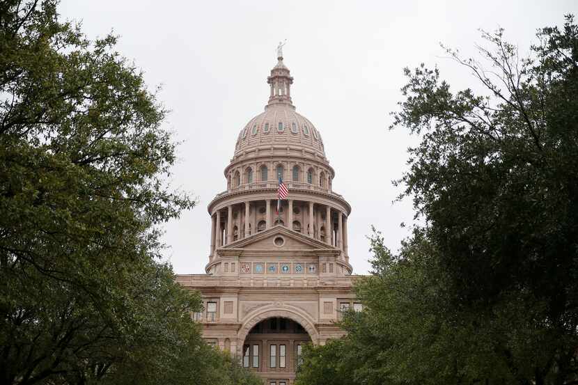 An exterior of the Texas State Capitol in Austin. State officials have cancelled public...