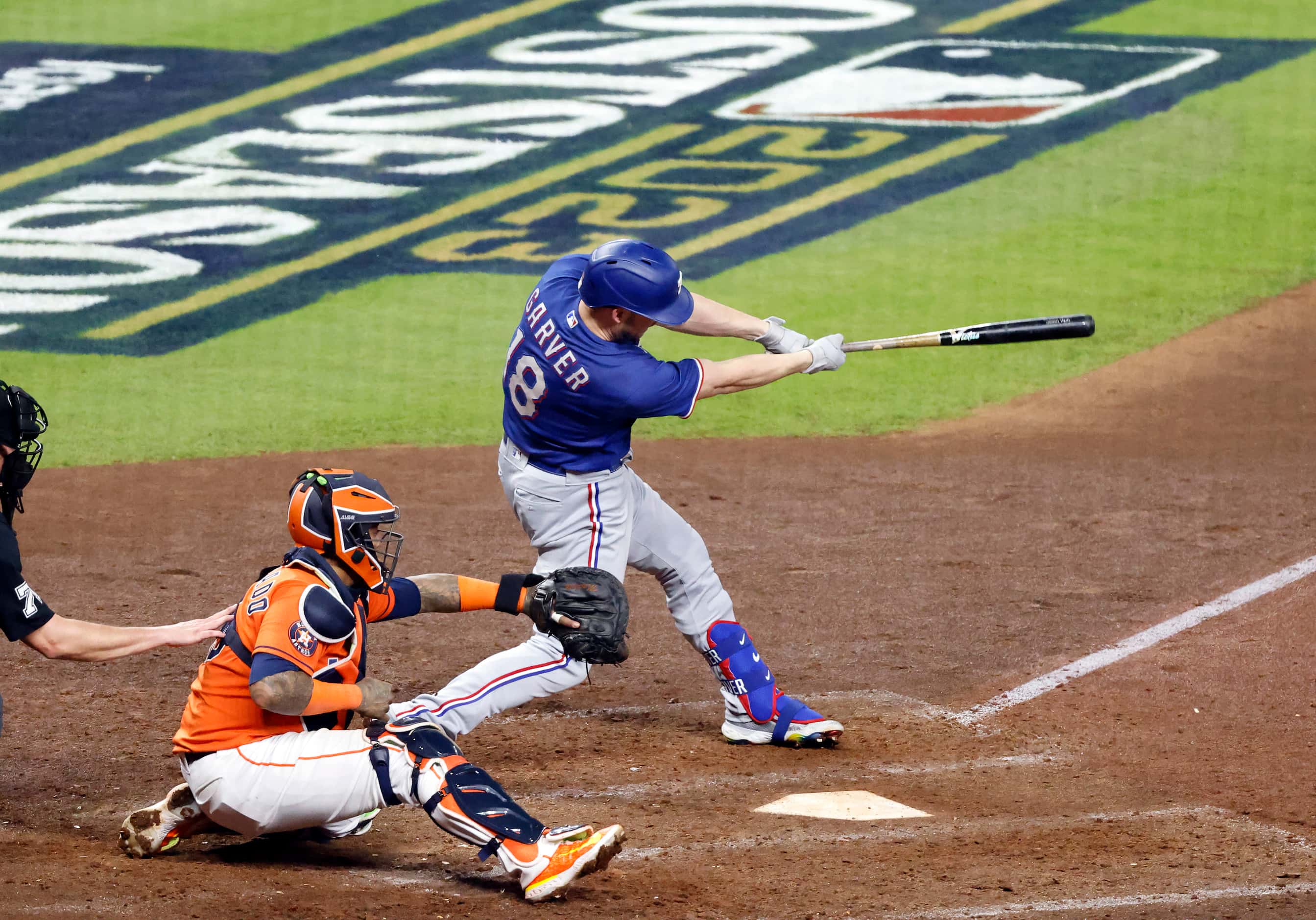 Texas Rangers Mitch Garver (18) strokes a RBI double in the eighth inning during Game 6 of...