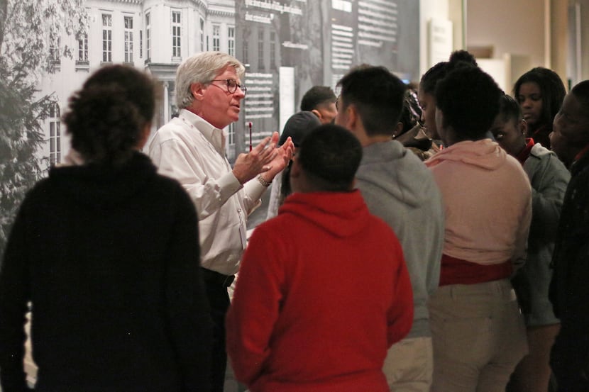 Docent educator Doug Stafford leads a group of students through the Dallas Holocaust and...