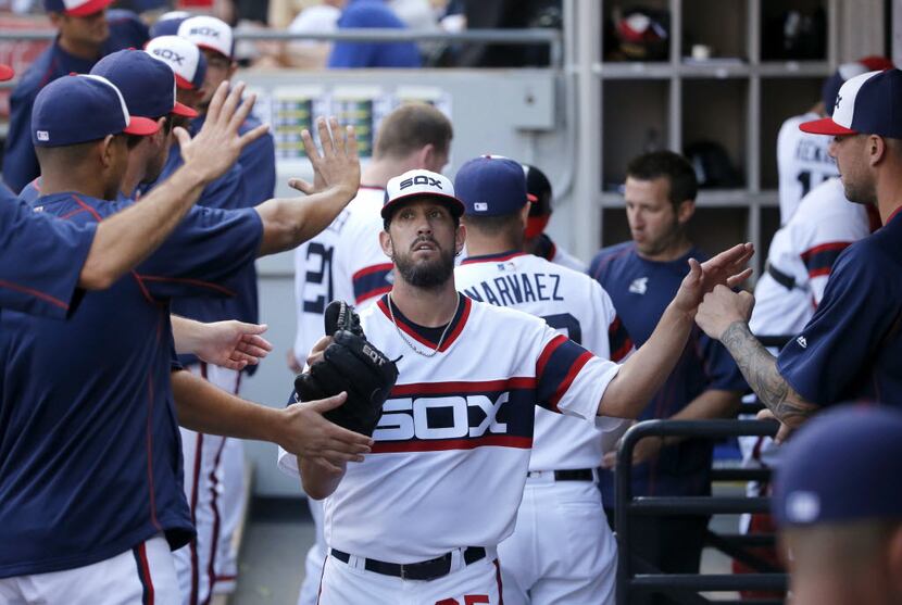 Chicago White Sox starting pitcher James Shields is greeted in the dugout after pitching out...
