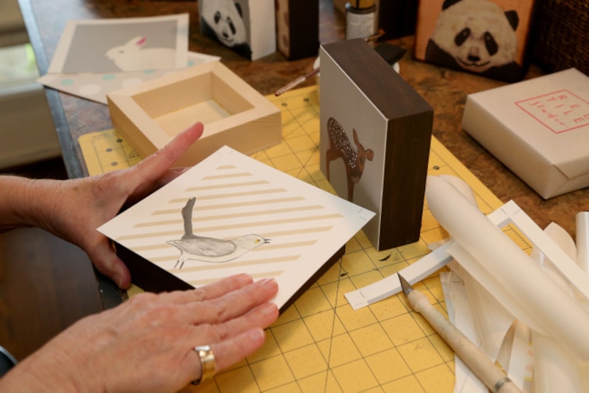 Red Tile Studio's Darleen Ingraham works on a tile at her studio in Dallas, Texas on...