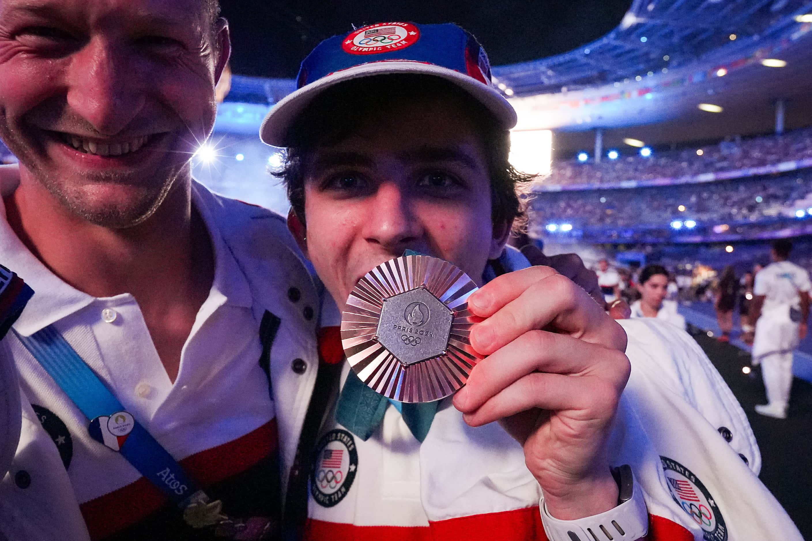 Sam Watson of the United States shows off his bronze medal from men’s speed climbing during...