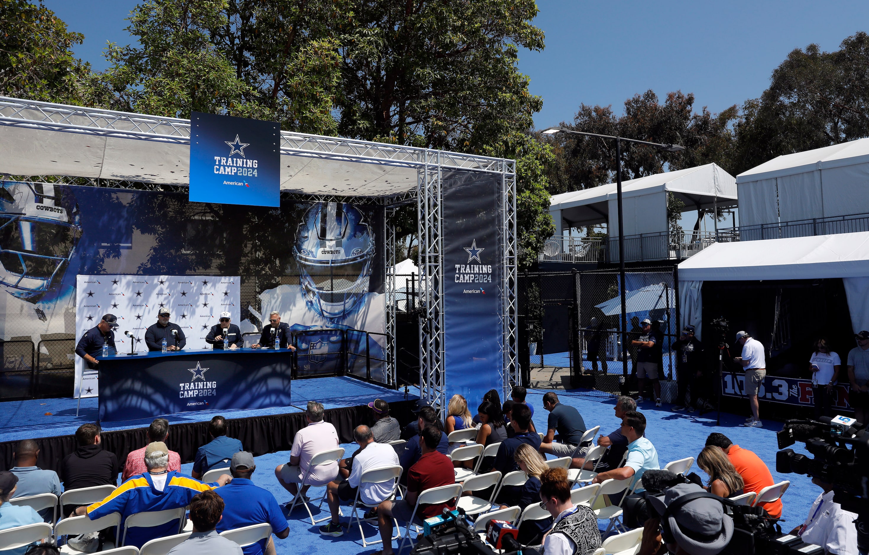 (From left on stage) Dallas Cowboys executive vice president, CEO, and director of player...