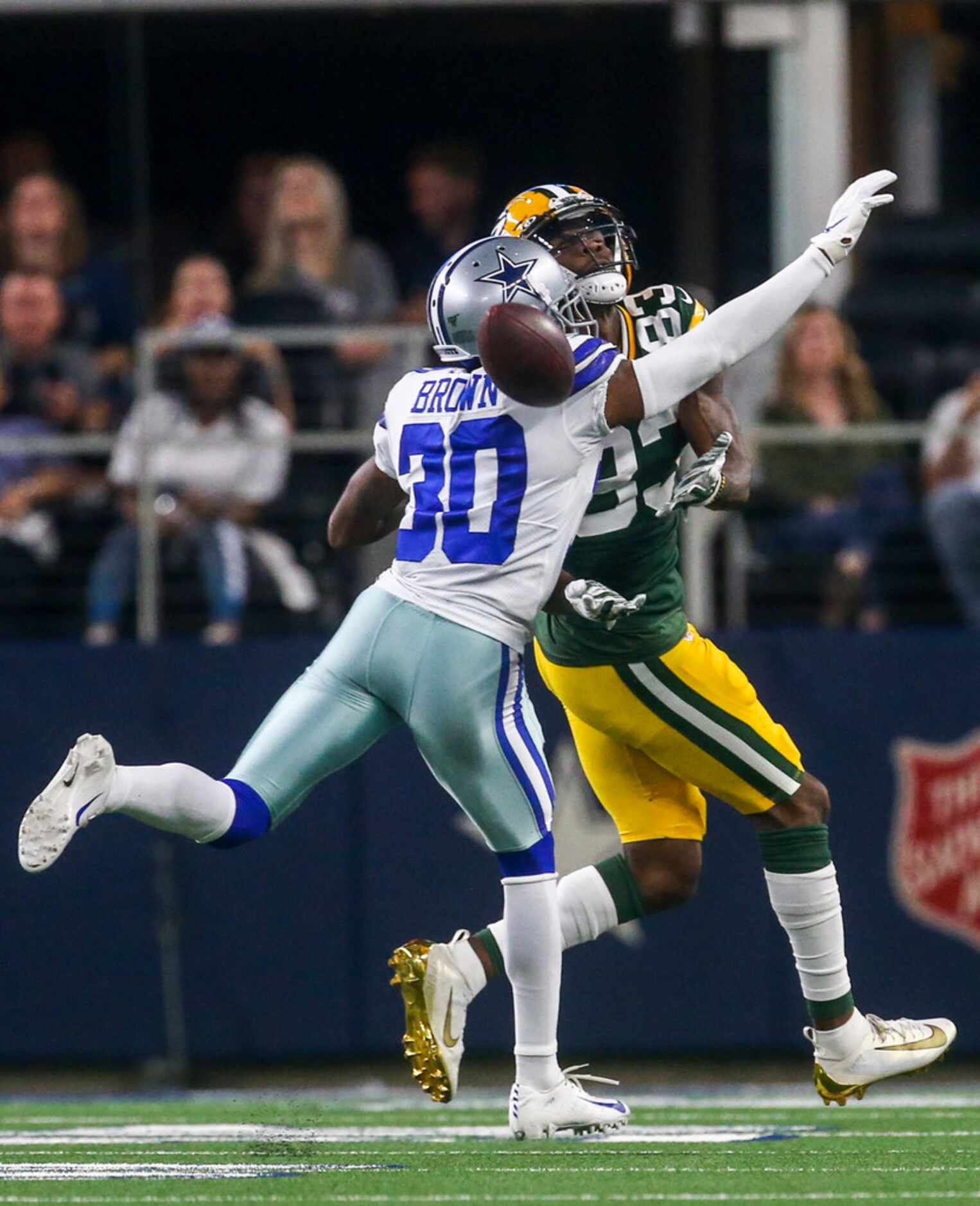 Dallas Cowboys cornerback Anthony Brown (30) breaks up a pass intended for Green Bay Packers...