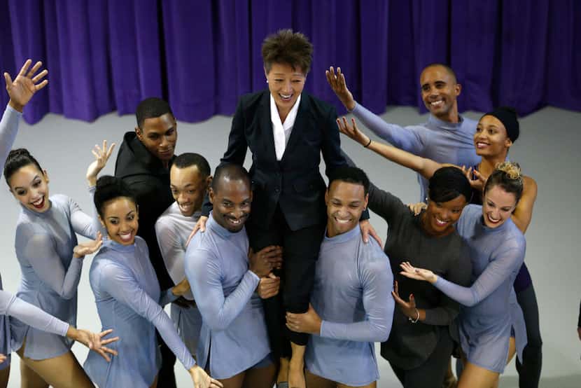 NEA chairman Jane Chu laughs as she is picked up for a photo with the Dallas Black Dance...