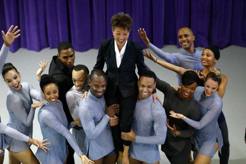 NEA chairman Jane Chu laughs as she is picked up for a photo with the Dallas Black Dance...