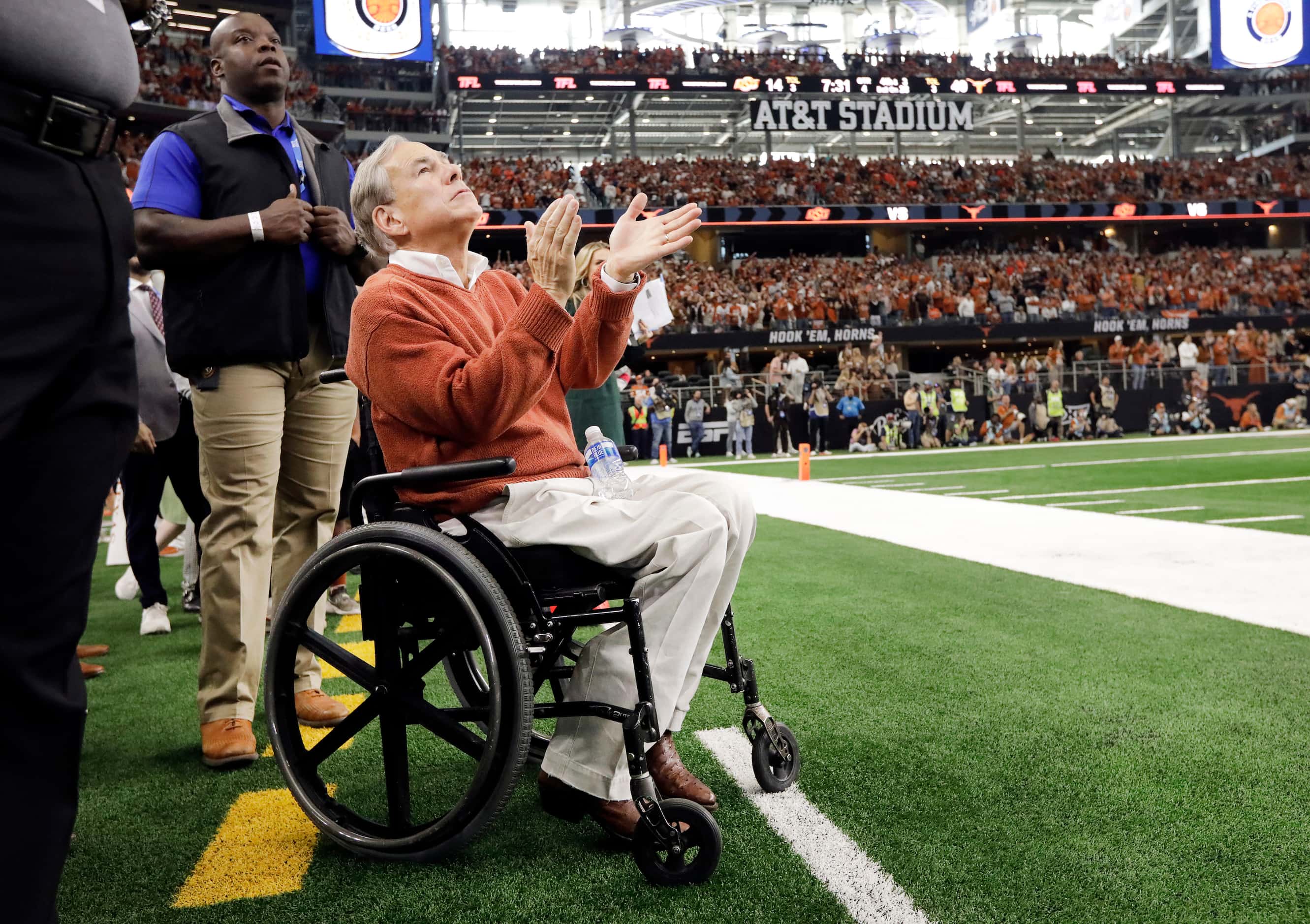 Texas Governor Greg Abbott applauds the play of the Texas Longhorns as they cruise to a Big...