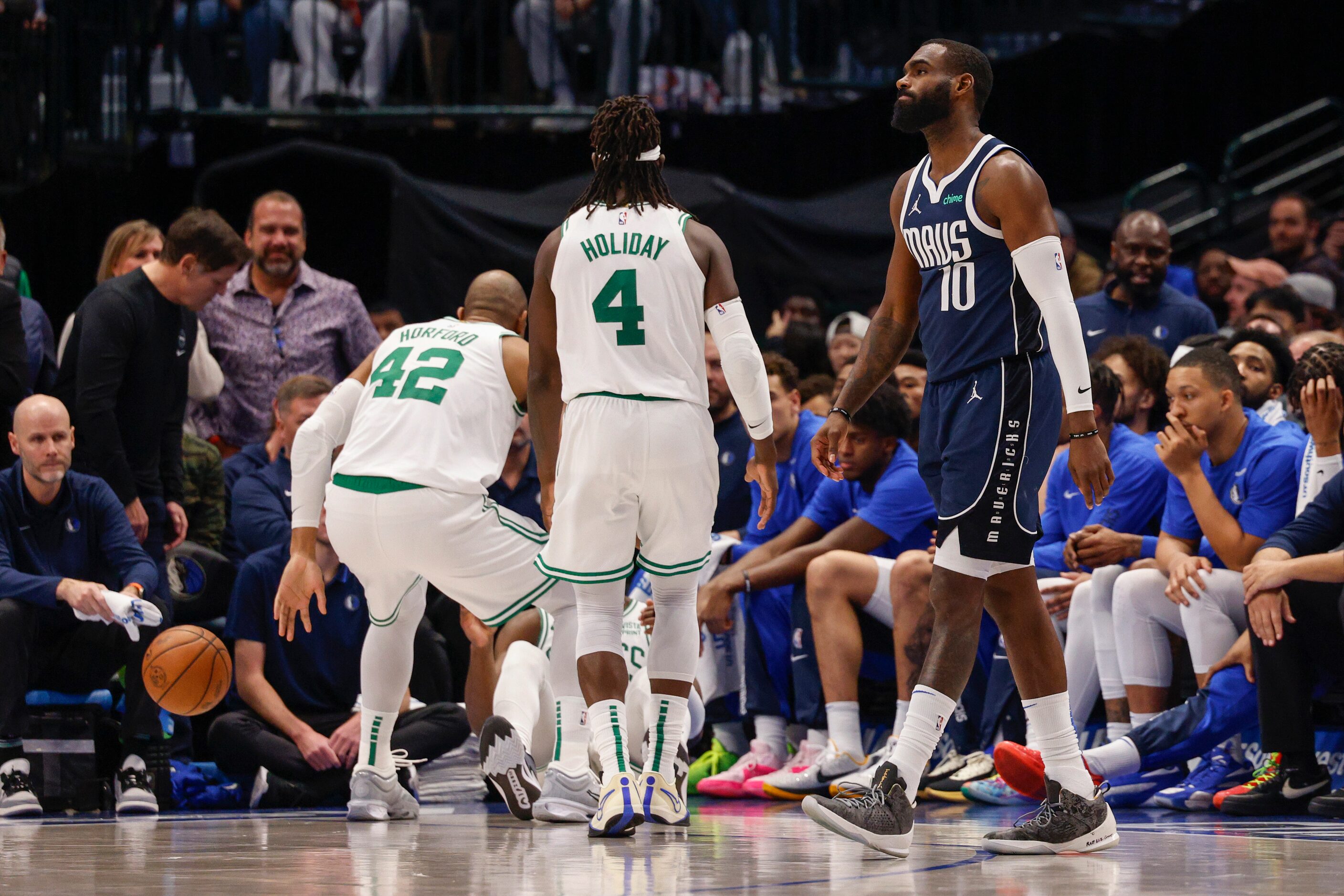 Dallas Mavericks forward Tim Hardaway Jr. (10) reacts after fouling Boston Celtics guard...