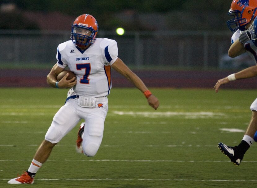 Colleyville Covenant senior quarterback Chase Stewart (7) runs toward the sideline after...