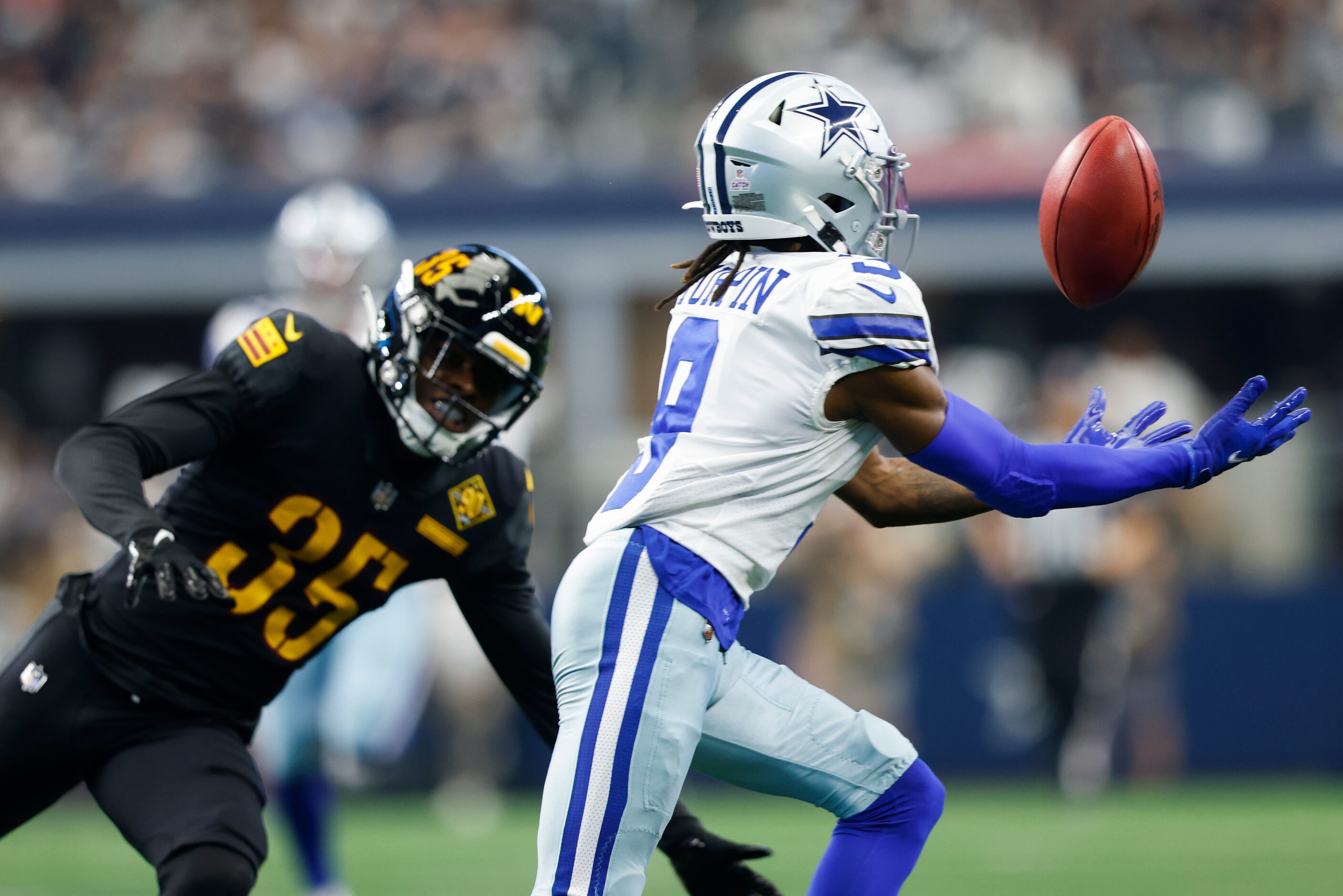 Dallas Cowboys wide receiver KaVontae Turpin (9) catches a Washington Commanders downfield...