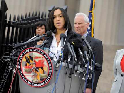 In happier times: On May 1, 2015, Baltimore State's Attorney Marilyn Mosby told a restive...