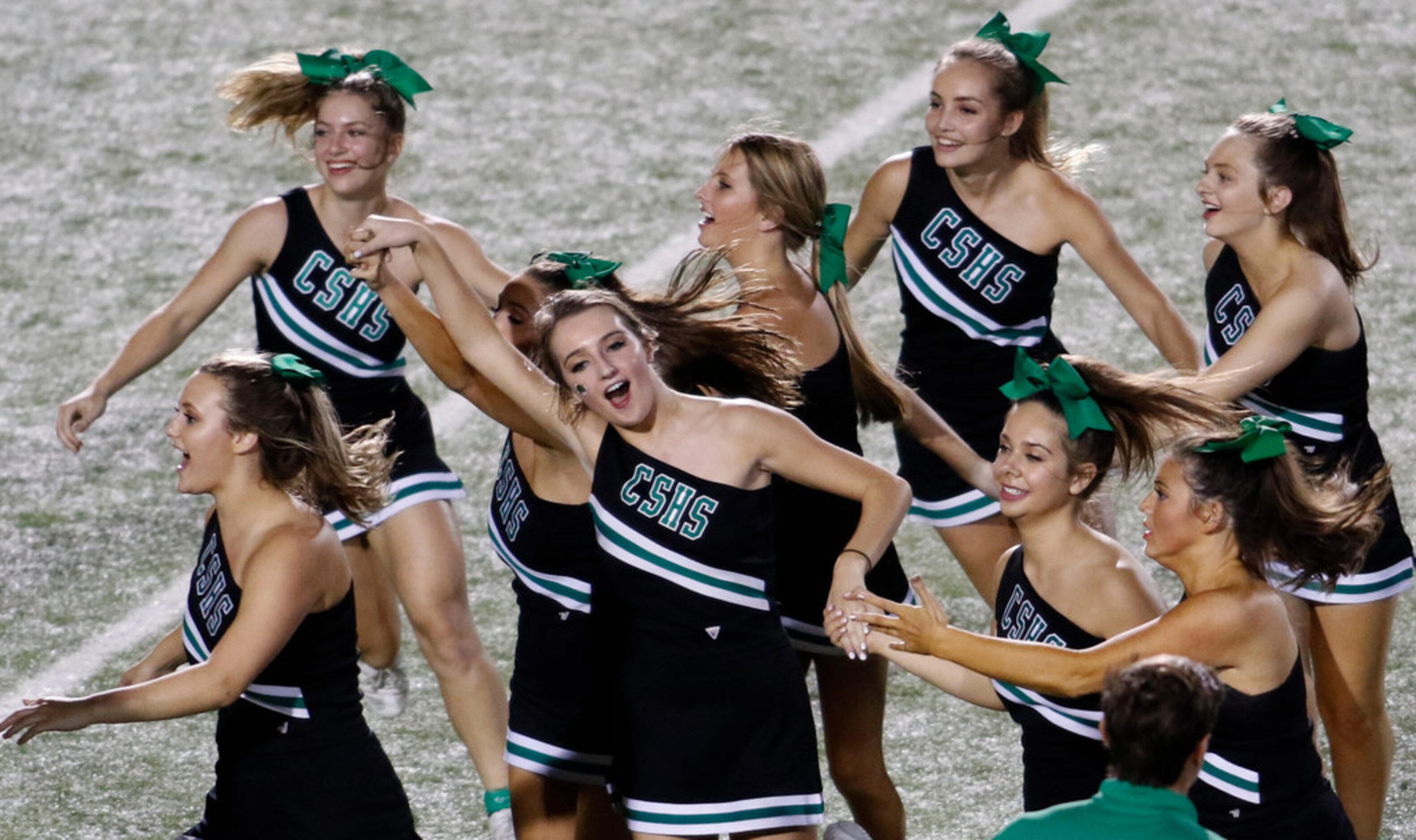 A group of Southlake Carroll cheerleaders celebrate their 35-21 victory over Flower Mound...