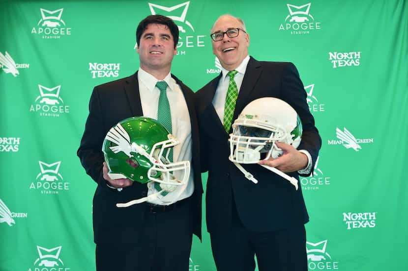 Seth Littrell poses with University of North Texas president Neal Smatresk at a press...