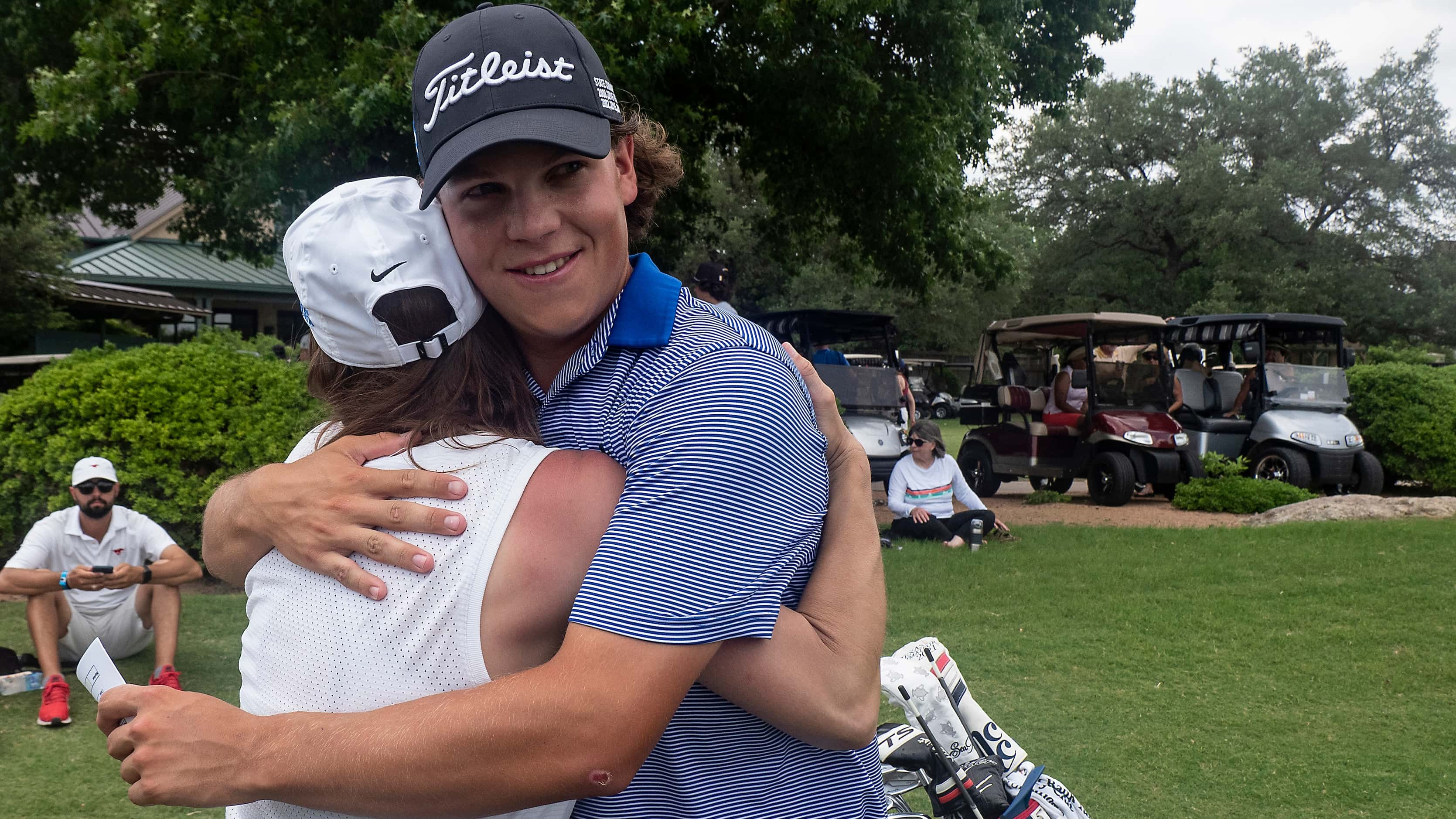 Plano West Matt Comegys gets a hug from his mom, Amanda Comegys after finishing the second...