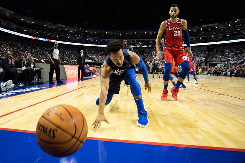 Dallas Mavericks guard Jalen Brunson (13) turns the ball over by losing it out of bounds as...