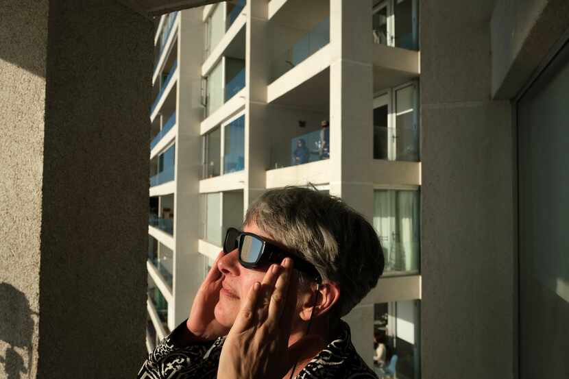 People watch a total solar eclipse on July 2, 2019, in La Serena, Chile.