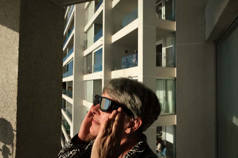 People watch a total solar eclipse on July 2, 2019, in La Serena, Chile.