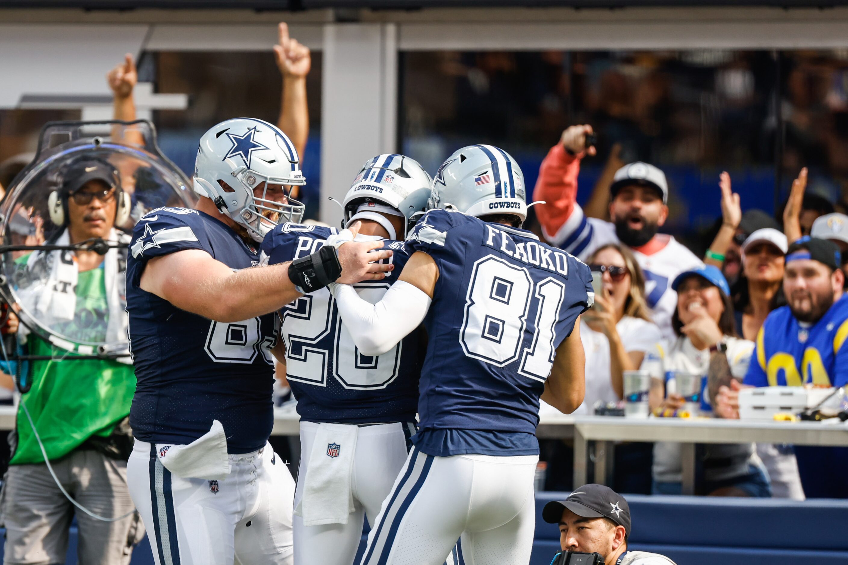 Dallas Cowboys running back Tony Pollard (20) celebrates a touchdown with his teammates...