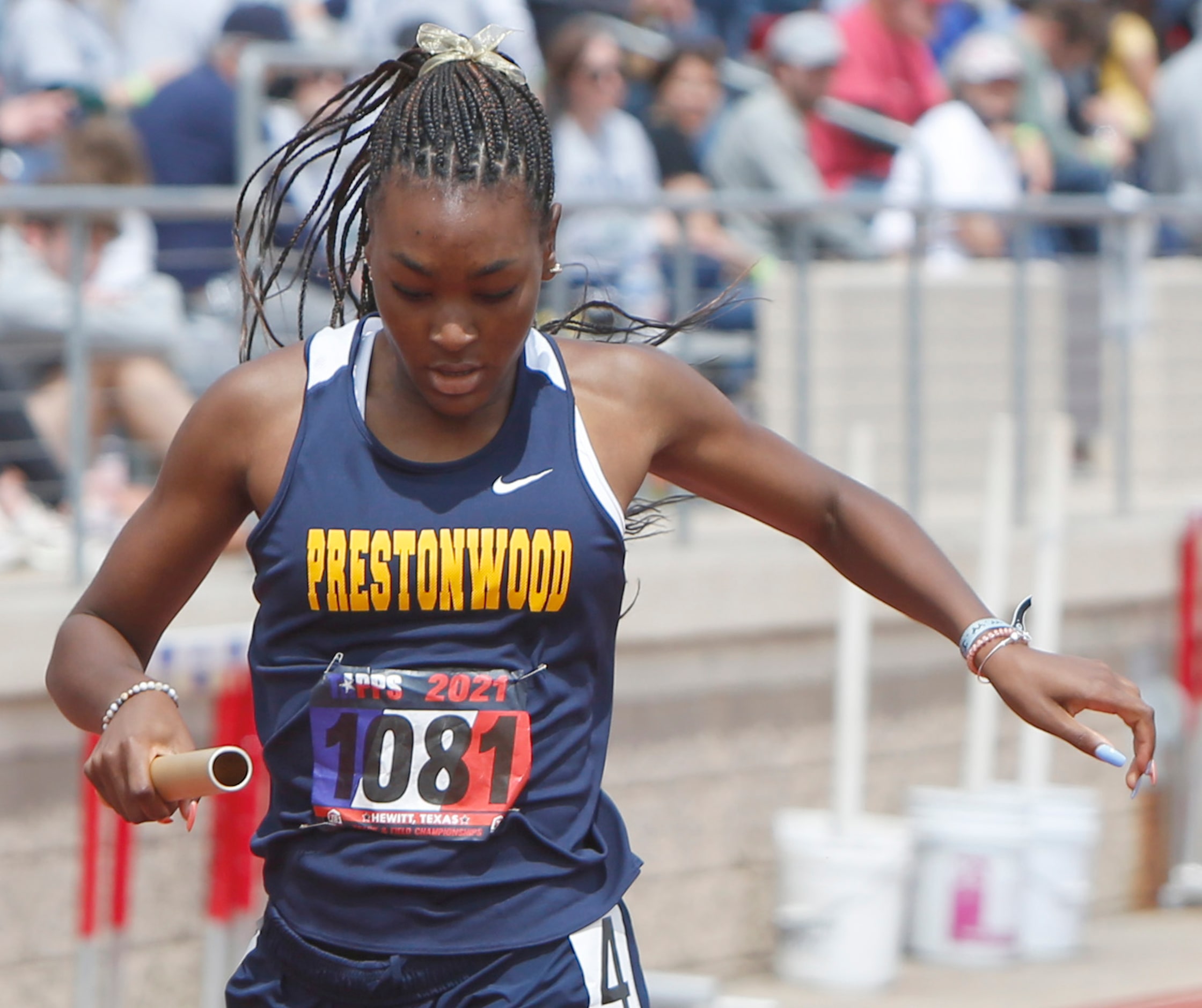 Plano Prestonwood's Nadia Thomas crosses the finish lane as she anchored the school's Class...