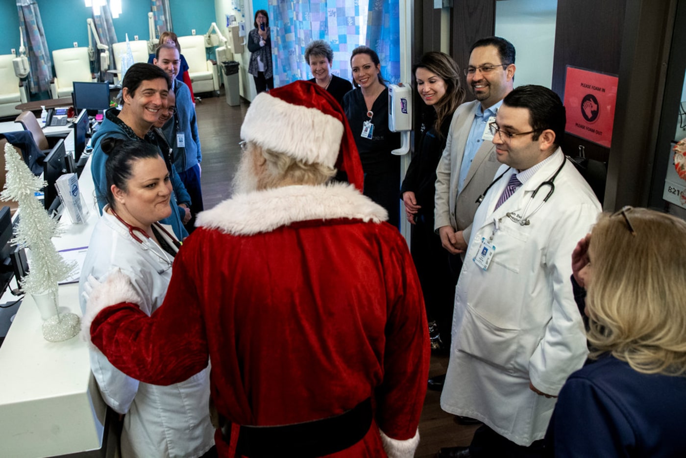 Paul McClain talks to his nurses and doctors during his checkup at the Texas Oncology-Baylor...