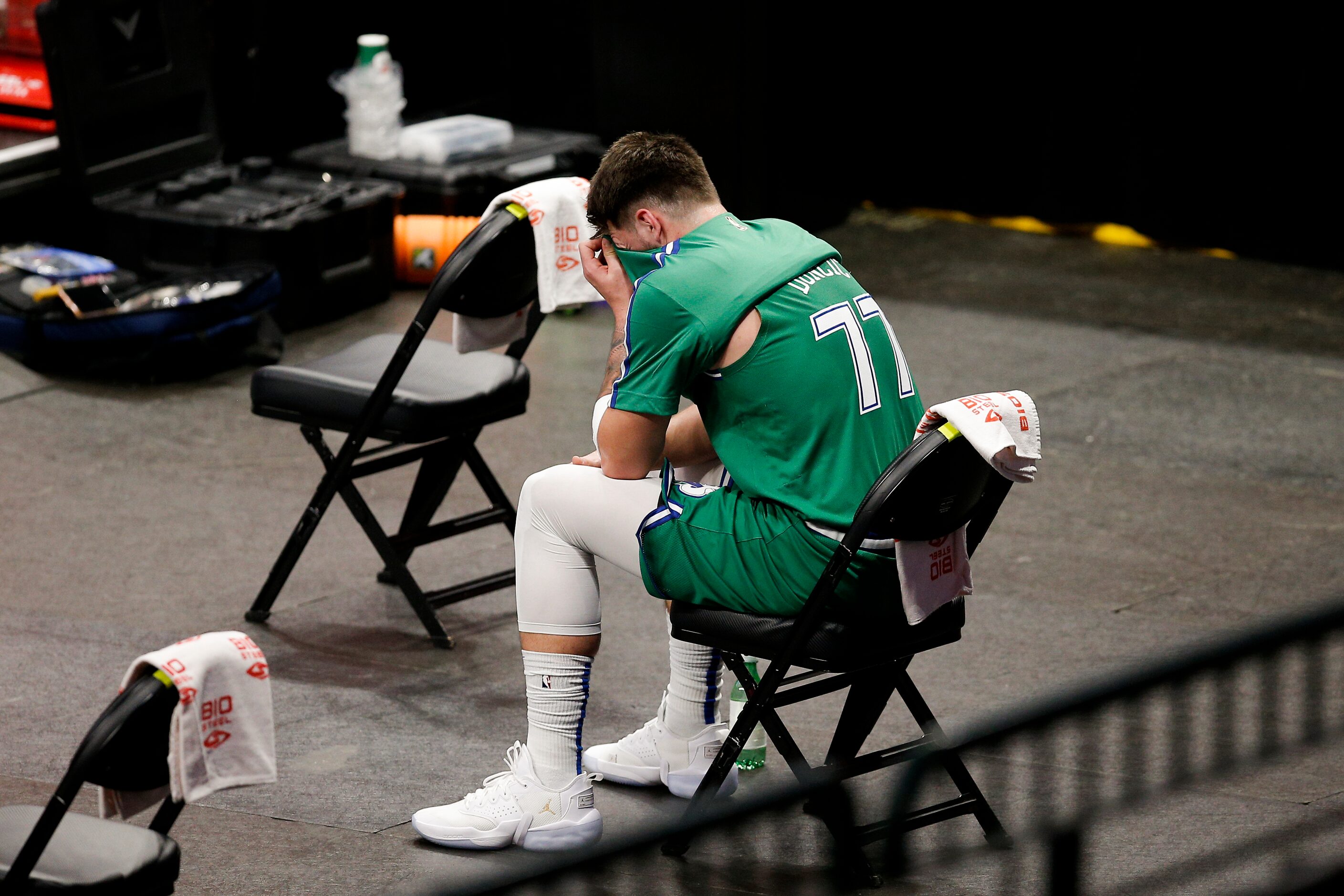 Dallas Mavericks guard Luka Doncic (77) sits on the bench after committing a technical foul...