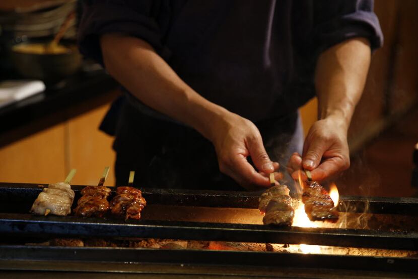 Teppo chef-owner Masayuki Otaka grills yakitori at Teppo. 