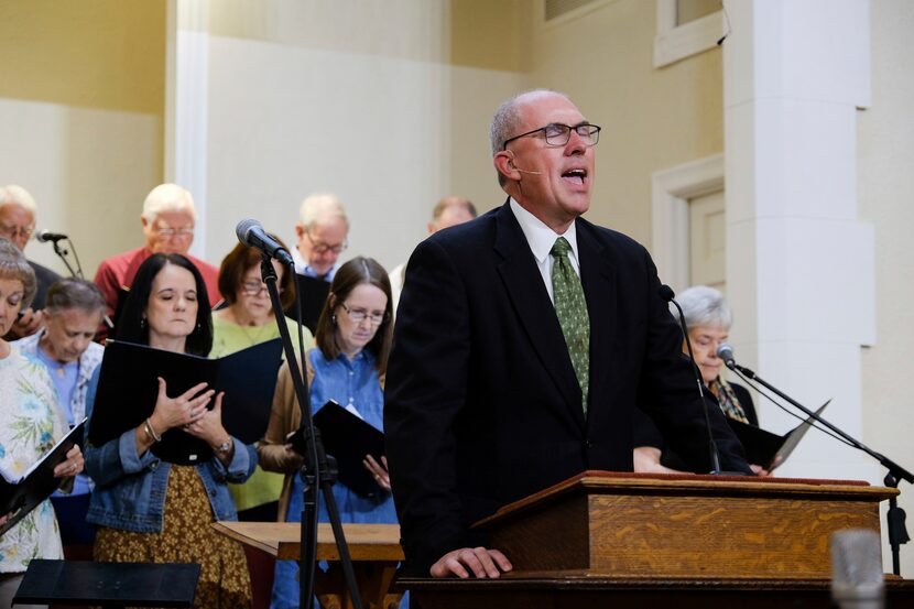 Pastor Bart Barber prays before service at the First Baptist Church of Farmersville, Texas,...