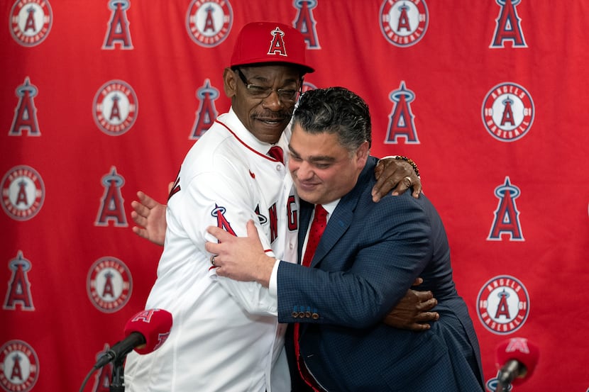 Ron Washington, left, the new manager of the Los Angeles Angels, and general manager Perry...