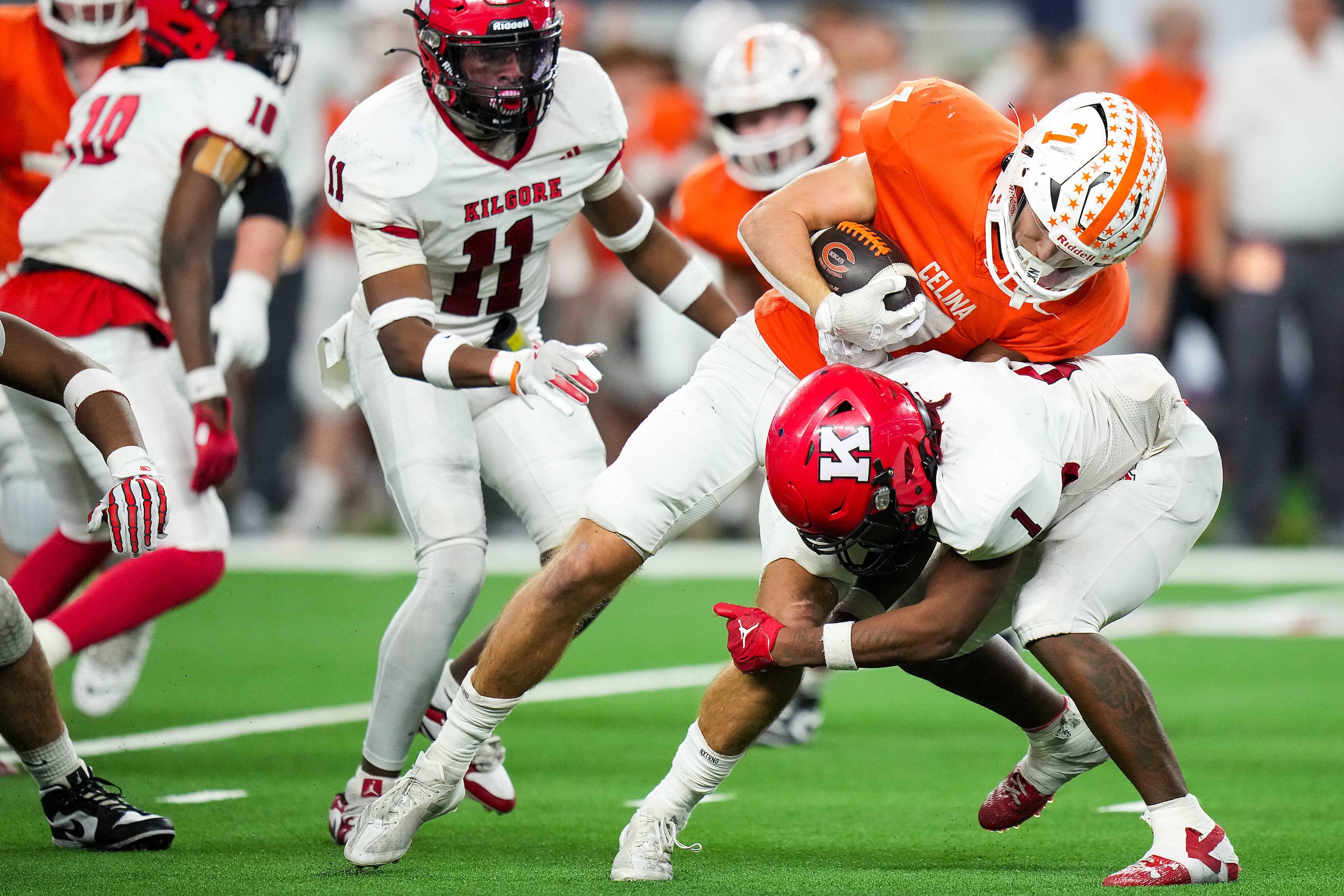 Celina's Harrison Williams (7) is brought down by Kilgore's Javon Towns (1) during the...