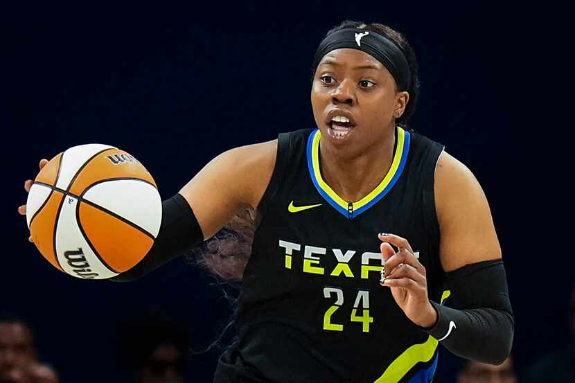 Dallas Wings guard Arike Ogunbowale (24) brings the ball up the court during the second half...
