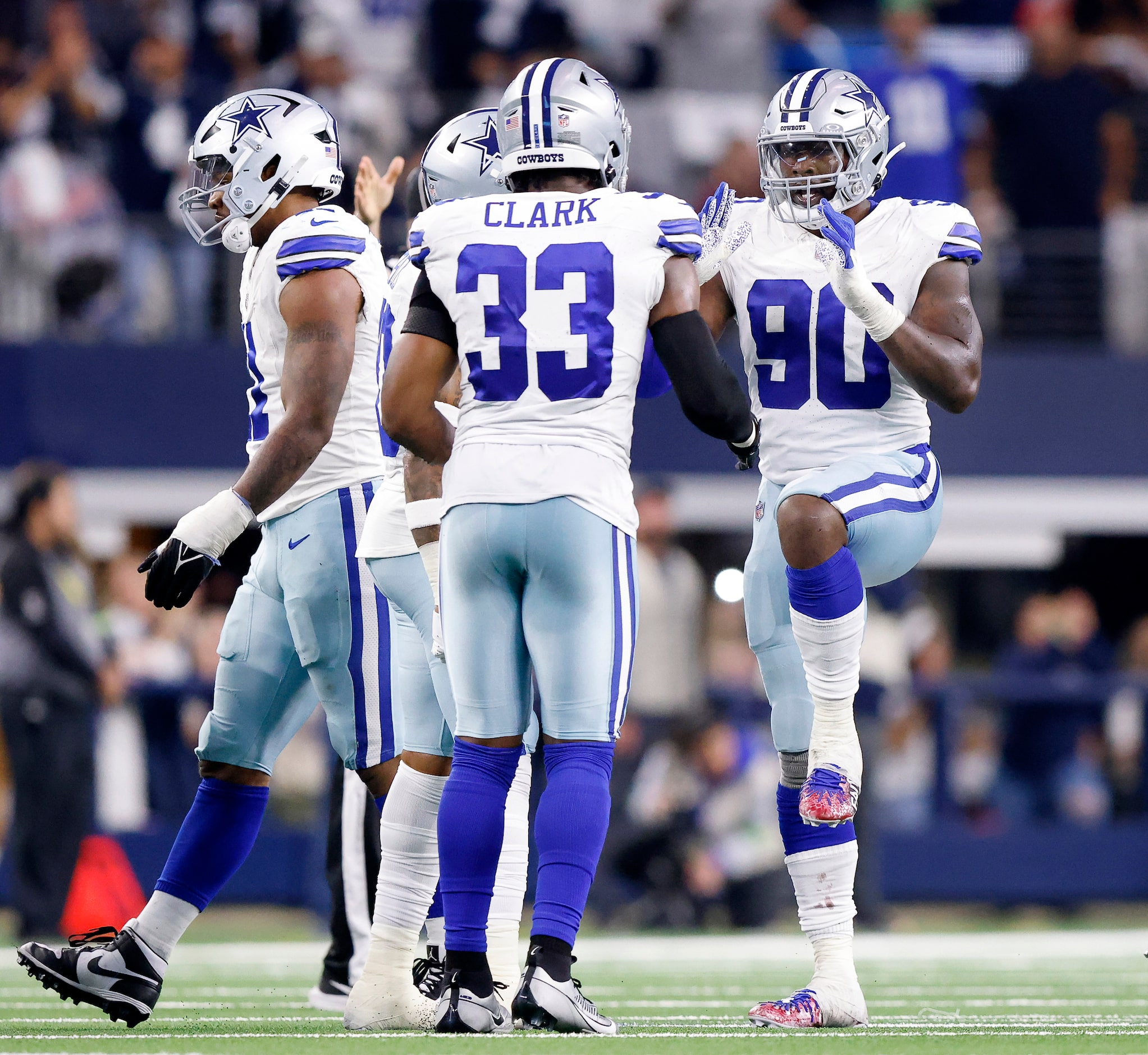 Dallas Cowboys defensive end DeMarcus Lawrence (90) celebrates his big stop of Seattle...