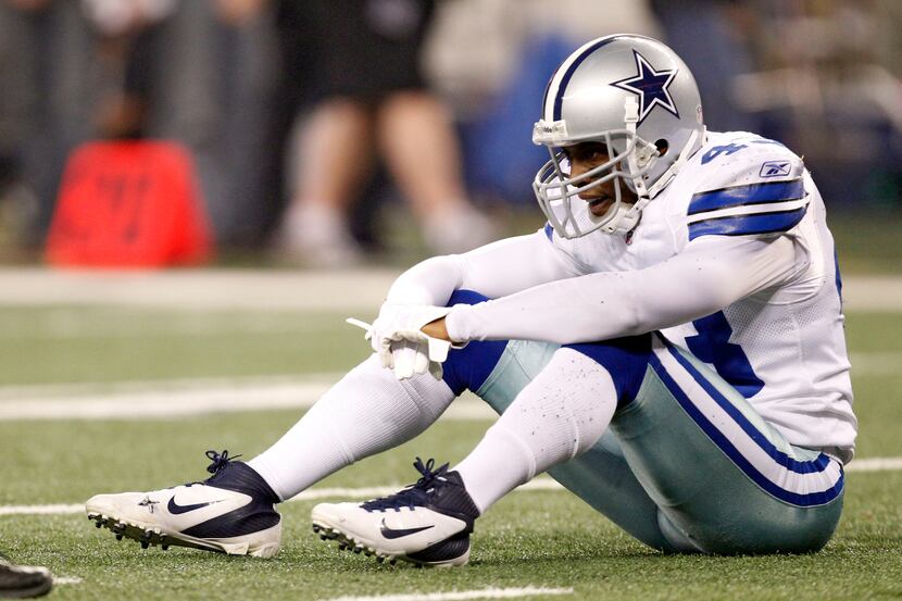 Dallas Cowboys free safety Gerald Sensabaugh (43) sits dejected after giving up a big play...
