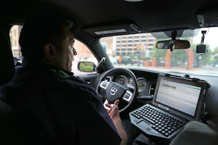 Dallas police Lieutenant Israel Herrera drives around Deep Ellum, near downtown Dallas,...