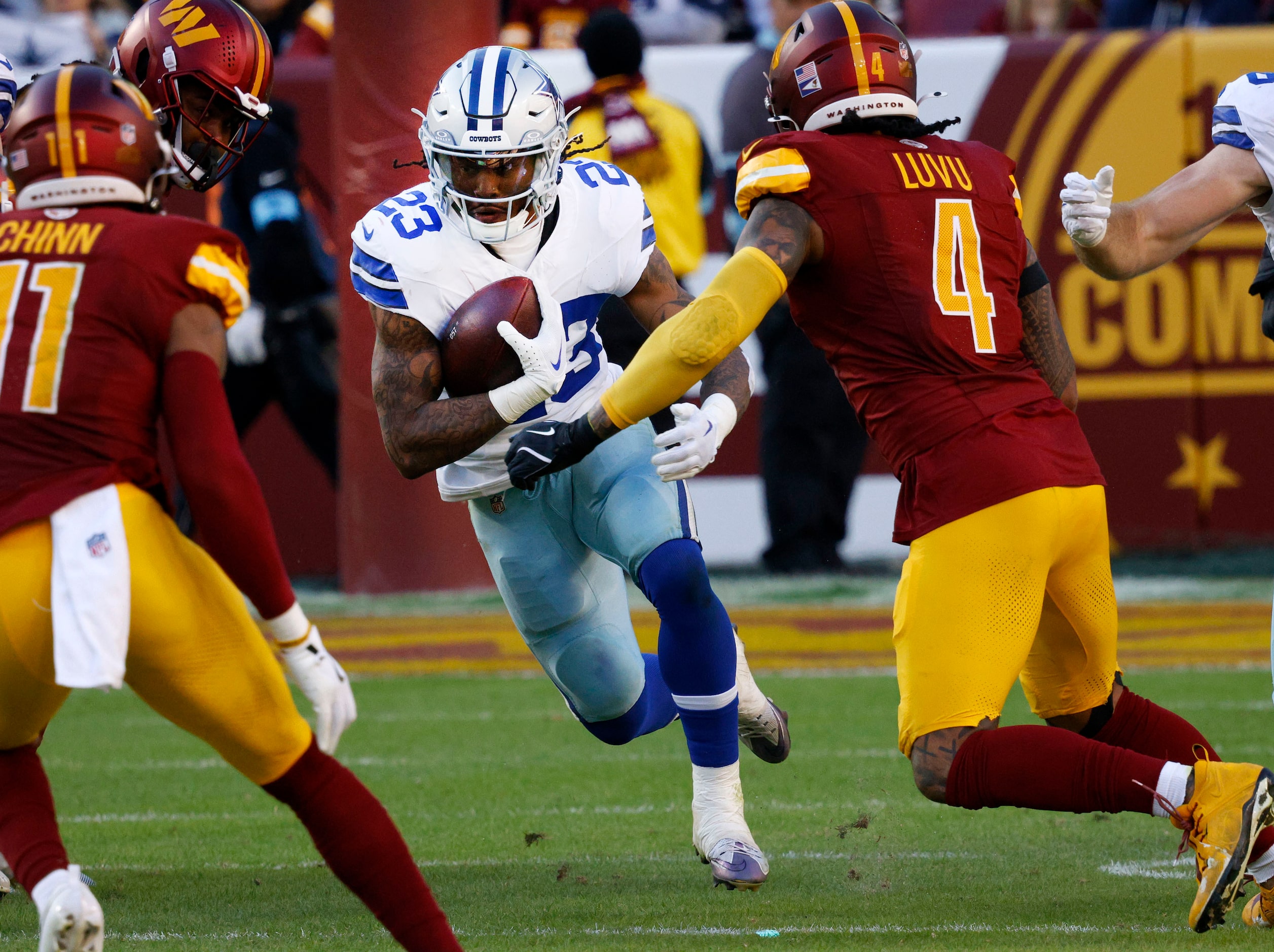 Dallas Cowboys running back Rico Dowdle (23) carries the ball against Washington Commanders...