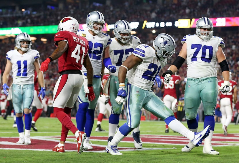 Dallas Cowboys running back Ezekiel Elliott (21) celebrates after scoring a rushing...